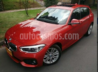 Foto venta Carro usado BMW Serie 1 116i 5P Aut (2016) color Naranja precio $71.900.000