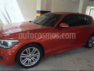 foto BMW Serie 1 118iA Sport usado (2015) color Naranja precio $49.999.999