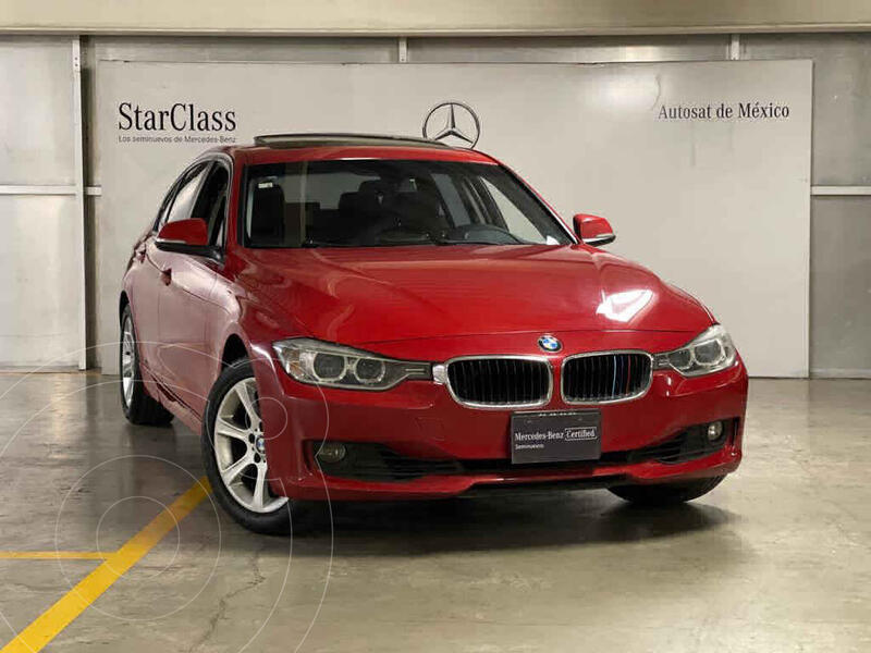 Foto BMW Serie 3 320iA Lujo usado (2013) color Rojo precio $270,000