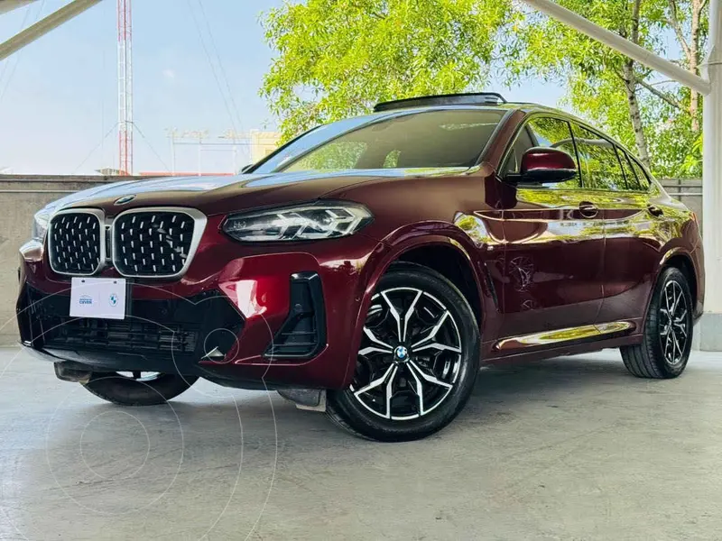 Foto BMW X4 xDrive30i usado (2024) color Rojo financiado en mensualidades(enganche $250,580 mensualidades desde $24,719)