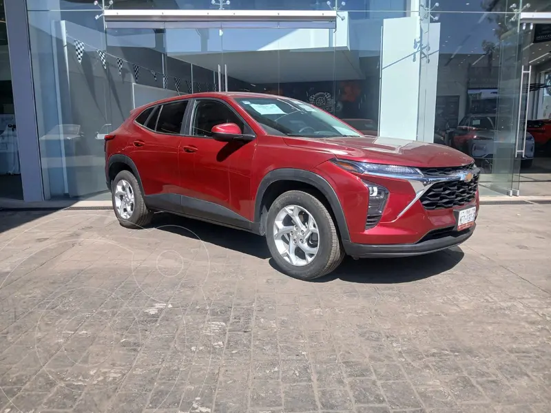Foto Chevrolet Trax LS usado (2024) color Rojo financiado en mensualidades(enganche $167,200 mensualidades desde $7,035)