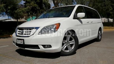 Honda Odyssey 5P TOURING TA QC PIEL 6 CD DVD RA-17 usado (2010) color Blanco precio $170,000