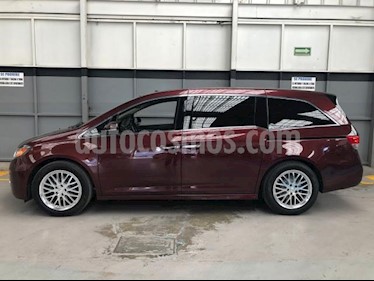 Honda Odyssey 5P TOURING TA A/AC. AUT. QC PIEL CD DVD F. HALOGE usado (2016) color Rojo precio $450,000
