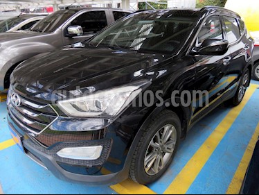 Foto venta Carro usado Hyundai Santa Fe 2.4 4x4 7 Pas. (2014) color Negro precio $68.900.000