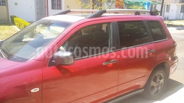 Foto Mitsubishi Outlander 2.4L ES usado (2004) color Rojo precio $75,000