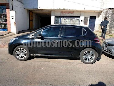 foto Peugeot 208 Feline 1.6 usado (2014) color Negro precio $440.000