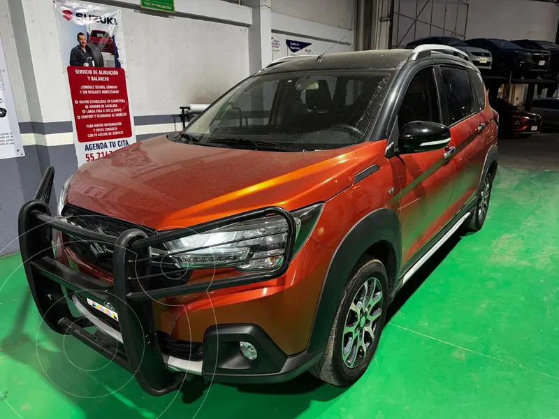 Foto Suzuki Ertiga XL7 GLX Aut usado (2023) color Naranja financiado en mensualidades(enganche $70,000)