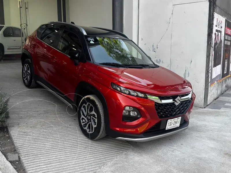 Foto Suzuki Fronx Boostergreen GLX usado (2025) color Naranja financiado en mensualidades(enganche $59,250)