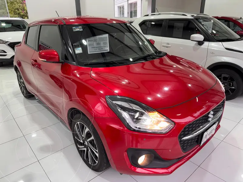 Foto Suzuki Swift GLX usado (2023) color Rojo financiado en mensualidades(enganche $75,275)