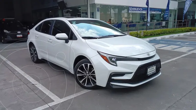 Foto Toyota Corolla SE Aut usado (2023) color Blanco financiado en mensualidades(enganche $181,412 mensualidades desde $7,633)