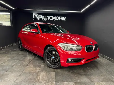 BMW Serie 1 120iA Urban Line usado (2016) color Rojo financiado en mensualidades(enganche $51,000 mensualidades desde $6,900)