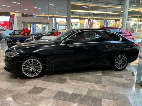 BMW Serie 3 320i usado (2021) color Negro financiado en mensualidades(enganche $121,800 mensualidades desde $11,774)
