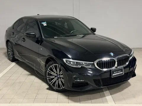 BMW Serie 3 330e usado (2022) color Negro financiado en mensualidades(enganche $279,976 mensualidades desde $12,028)