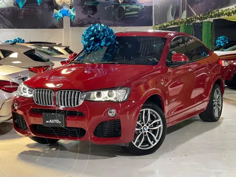 BMW X4 M 3.0L usado (2018) color Rojo Melbourne financiado en mensualidades(enganche $246,397 mensualidades desde $15,806)