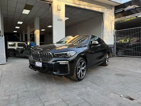 BMW X6 M50iA usado (2021) color Negro financiado en mensualidades(enganche $260,000 mensualidades desde $36,885)