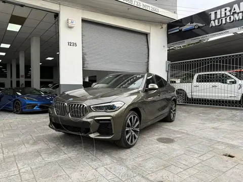 BMW X6 M50i usado (2023) color Verde financiado en mensualidades(enganche $300,000 mensualidades desde $42,181)
