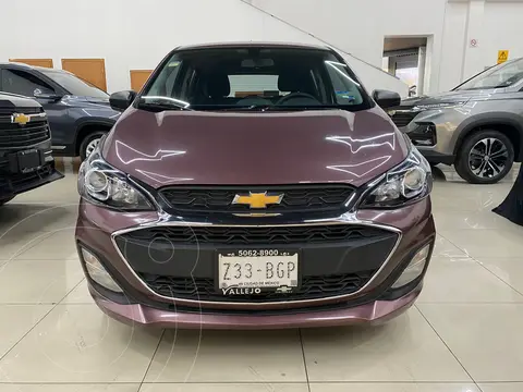 Chevrolet Spark LT usado (2020) color violeta oscuro financiado en mensualidades(enganche $55,750 mensualidades desde $4,077)