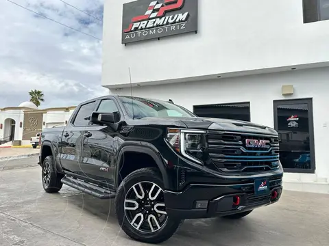 GMC Sierra AT4 usado (2022) color Negro financiado en mensualidades(enganche $329,560 mensualidades desde $28,721)