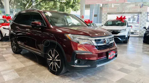 Honda Pilot Touring usado (2019) color Rojo Cobrizo financiado en mensualidades(enganche $168,862 mensualidades desde $9,077)