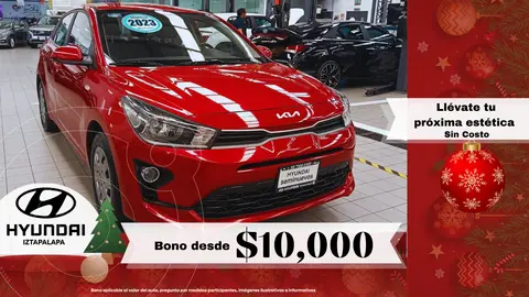 Kia Rio Sedan L  Aut usado (2023) color Rojo financiado en mensualidades(enganche $91,918 mensualidades desde $3,867)