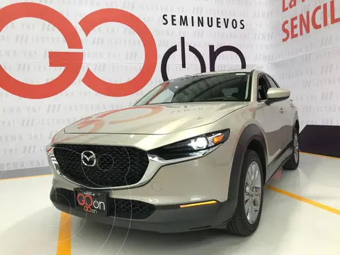Mazda CX-30 i Grand Touring usado (2023) color Dorado financiado en mensualidades(enganche $114,450 mensualidades desde $8,752)