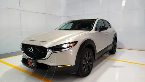 Mazda CX-30 Signature usado (2023) color coral claro financiado en mensualidades(enganche $117,175 mensualidades desde $8,960)