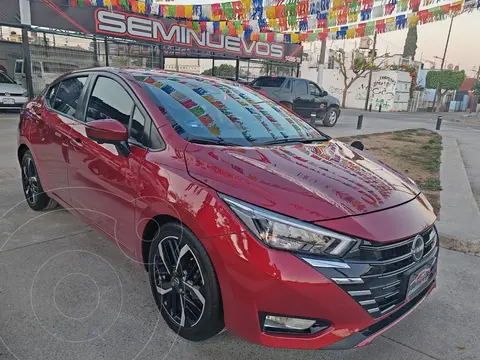 Nissan Versa Exclusive Aut usado (2023) color Rojo Metalizado financiado en mensualidades(enganche $109,469 mensualidades desde $7,346)