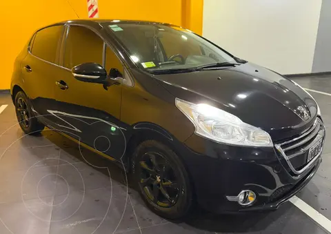 Peugeot 208 Allure 1.5 usado (2014) color Negro financiado en cuotas(anticipo $8.000.000 cuotas desde $400.000)