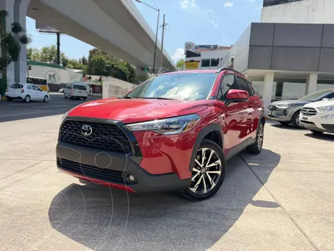 Toyota Corolla Cross HEV LE usado (2024) color Rojo financiado en mensualidades(enganche $117,700 mensualidades desde $13,214)