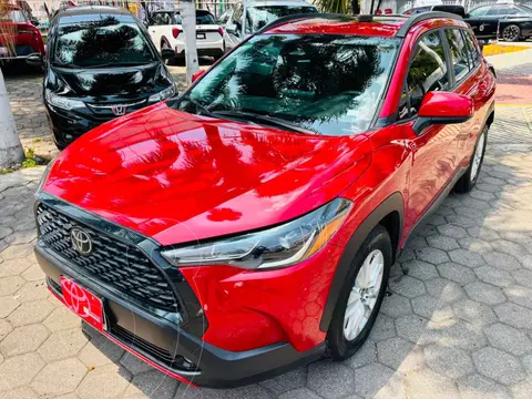 Toyota Corolla Cross LE usado (2023) color Rojo financiado en mensualidades(enganche $117,444 mensualidades desde $10,432)