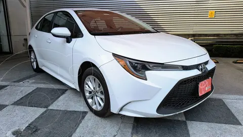 Toyota Corolla LE Aut usado (2020) color Blanco financiado en mensualidades(enganche $91,000 mensualidades desde $3,211)