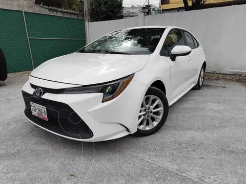 Toyota Corolla LE 1.8L Aut usado (2020) color Blanco financiado en mensualidades(enganche $67,100 mensualidades desde $7,766)