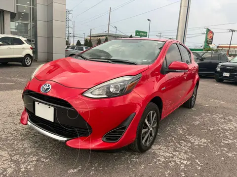 Toyota Prius C 1.5L usado (2021) color Rojo financiado en mensualidades(enganche $60,256 mensualidades desde $6,574)